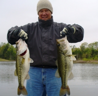 Cortney Coe holds two nice bass at Longbranch Yates Place.
