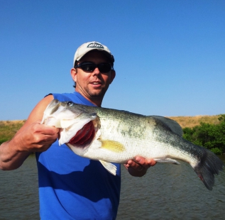 Clint Whittlock holds a 13.2 pound monster caught at Bowie Backside of the moon in early summer.