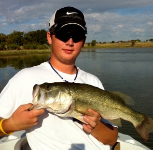 Jordan Massey holds his best catch on a warm summer day at Decatur Beaver Lake.