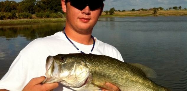 Jordan Massey holds his best catch on a warm summer day at Decatur Beaver Lake.