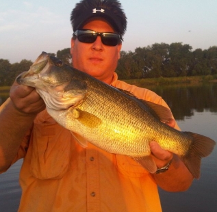 Mark Levock holds a 7 pounder caught at Van Alstyne JerMar Lake in mid-summer.