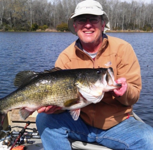 Mark Shirley holds a 13.7 lb bass caught at Oakwood Lake Leon. We believe this is the lake record. Nice fish Mark!
