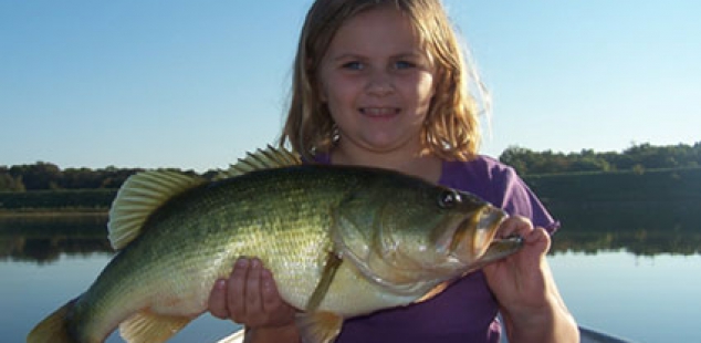 Brad Sheilds daughter landing a fish nearly as big as she is.