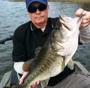 Ed Hueske holds a nice 8.5lb at Longbranch Yates Place.